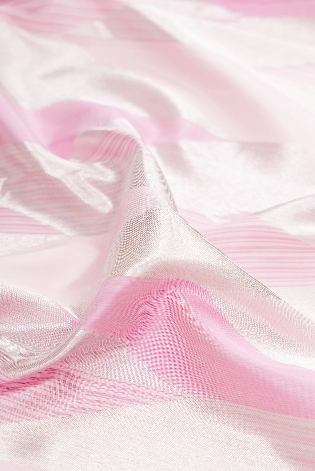 Close up of Pure Silk Rose pink Kanchipuram Saree with Zari Brocade on the body and Zari Border.  displaying folds