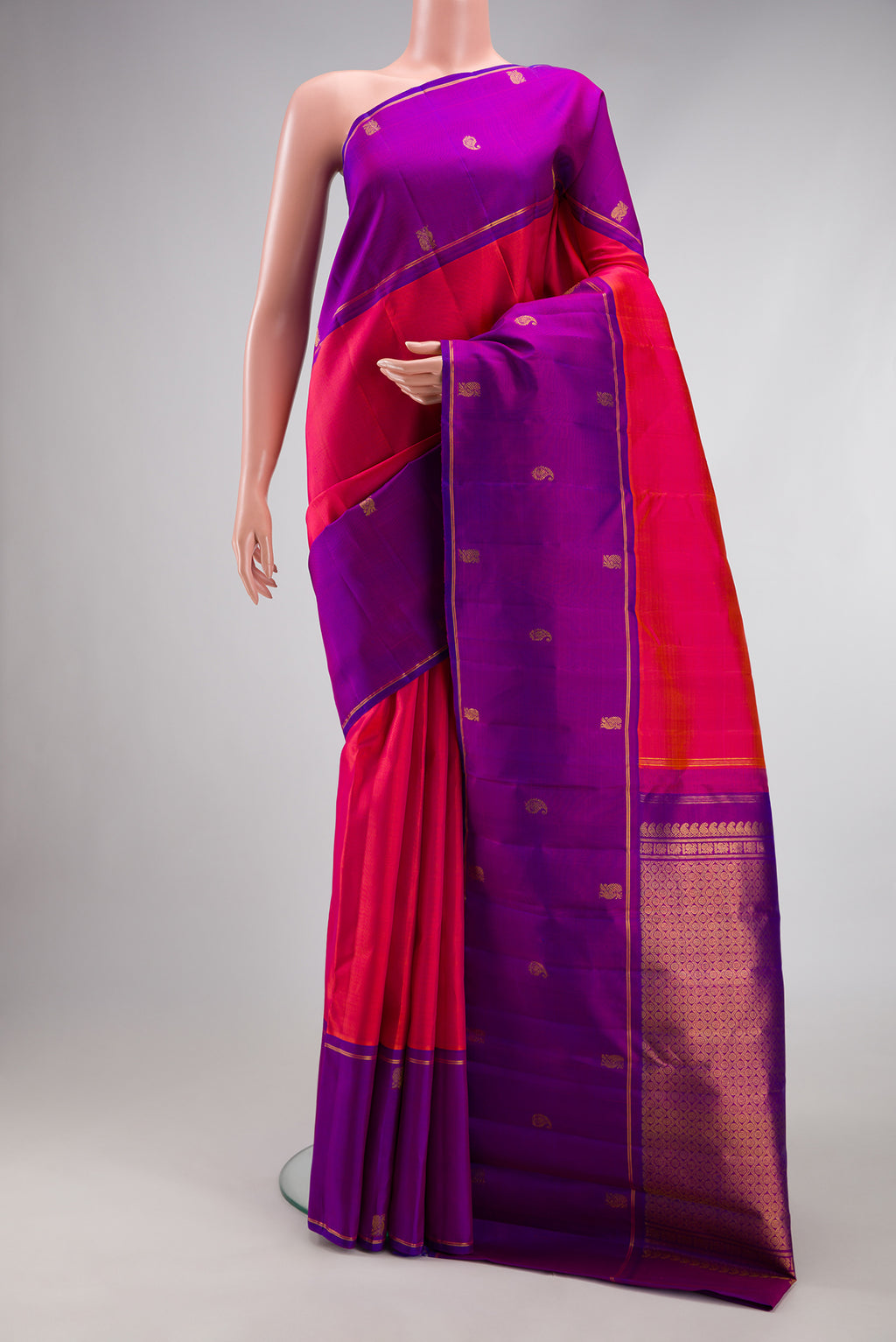 Pink Dual Tone Kanchipuram Silk Saree with Plain Body and Zari Border.  displayed on a mannequin