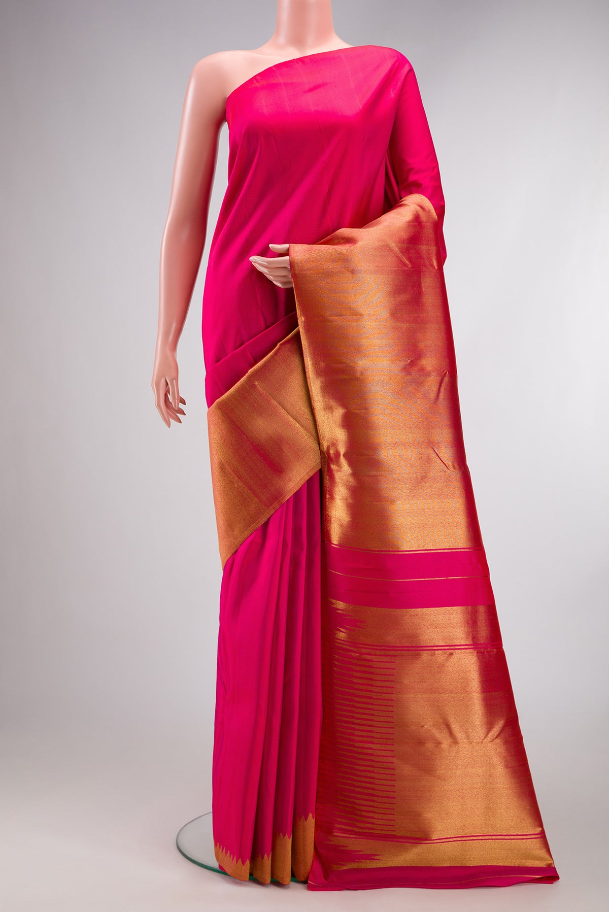 Pink Kanjivaram Silk Saree with Plain Body and Rising Temple Border.  displayed on a mannequin