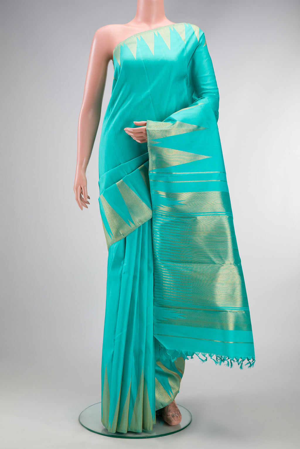 Pure Silk Pure Zari Turquoise Kanchipuram Saree with Plain Body and Temple Border.  displayed on a mannequin