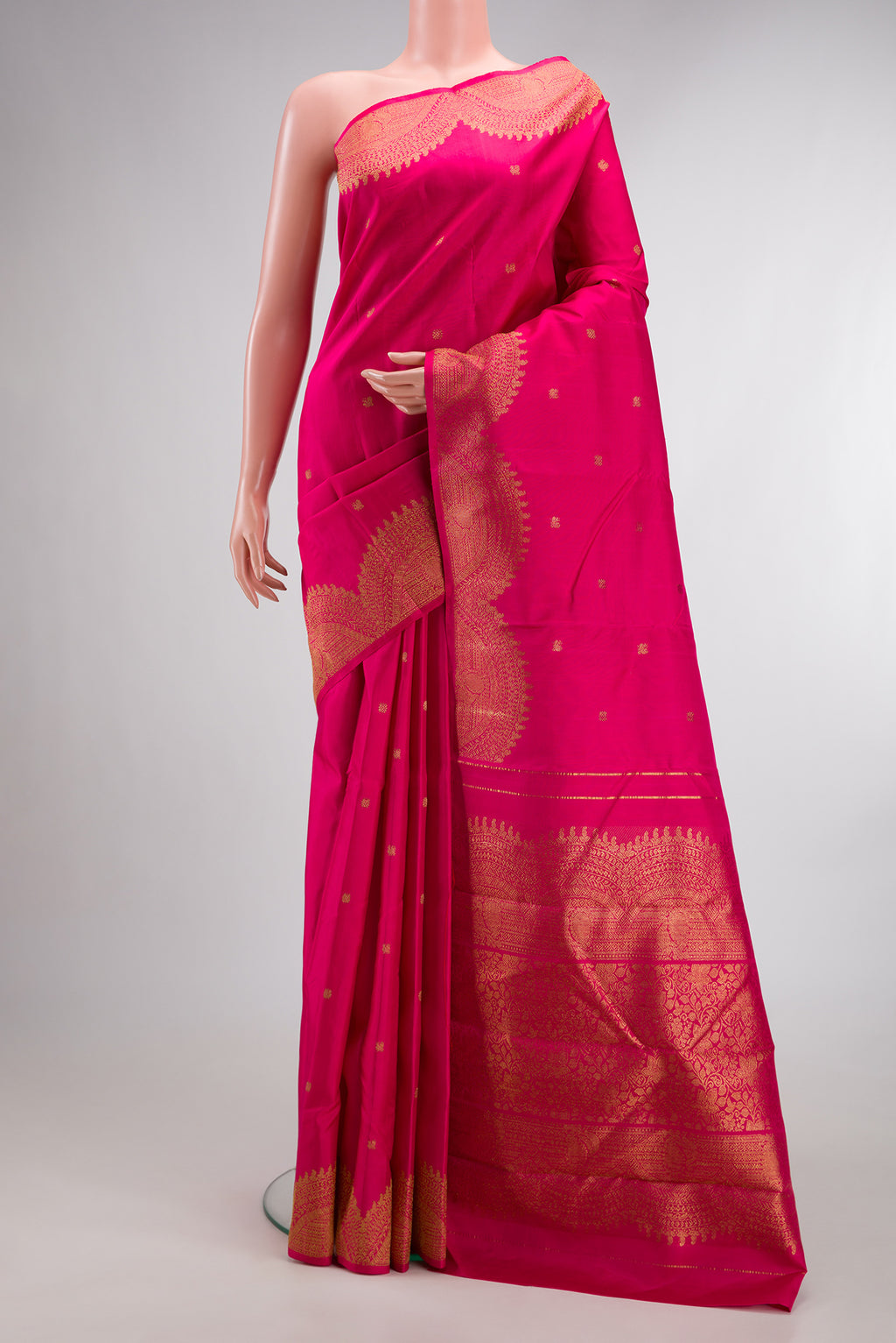 Pure Silk Pure Zari Pink Kanjivaram Saree with Zari Butta on the body and Fancy Border.  displayed on a mannequin
