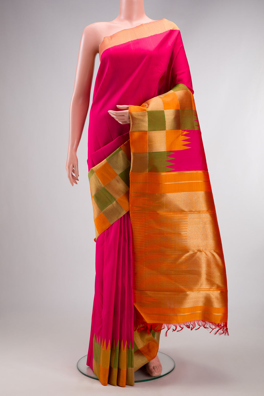 Pure Silk Pure Zari Pink Kanjivaram Saree with Plain Body and Temple Border.  displayed on a mannequin