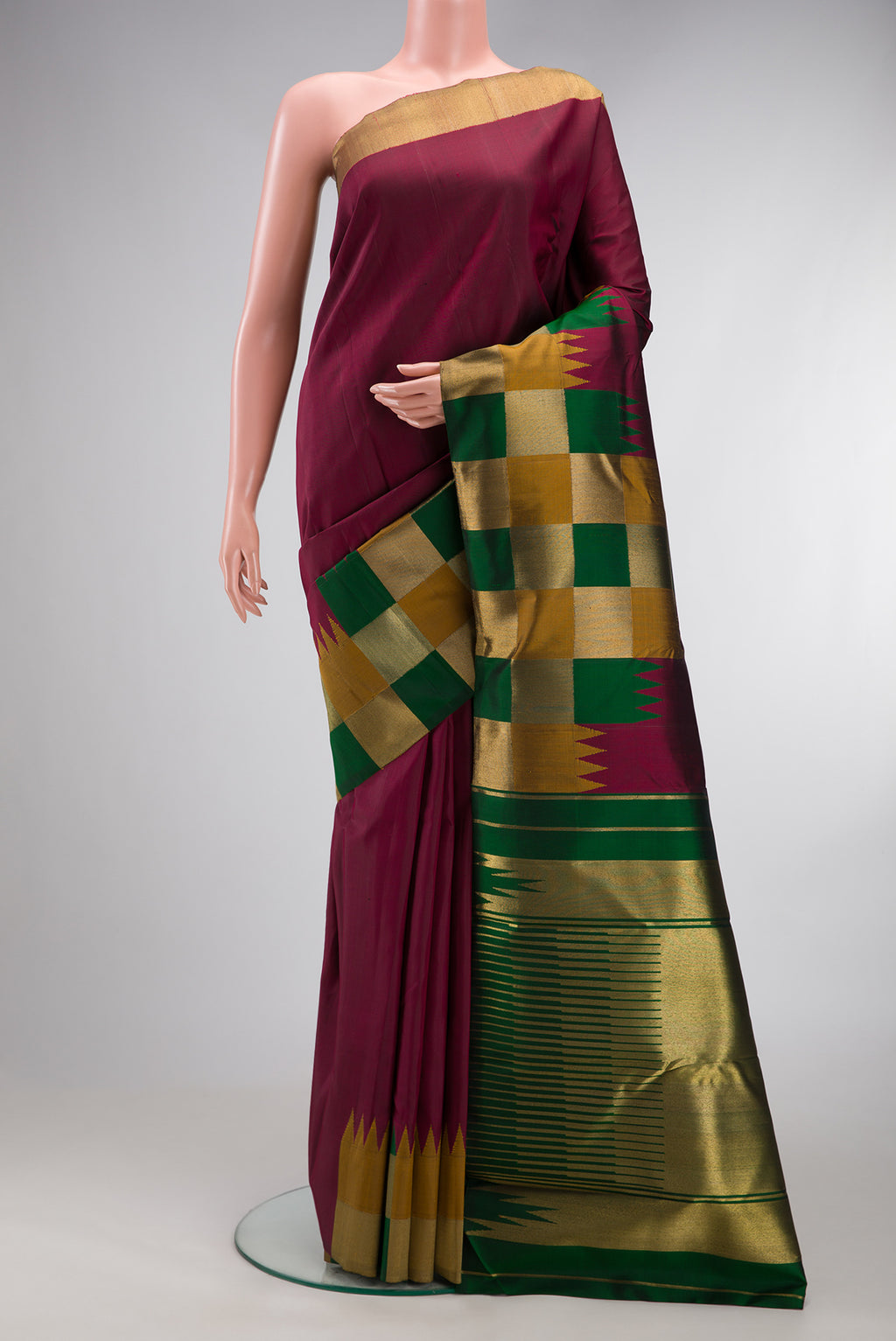 Pure Silk Pure Zari Maroon Kanjivaram Saree with Plain Body and Fancy Border.  displayed on a mannequin