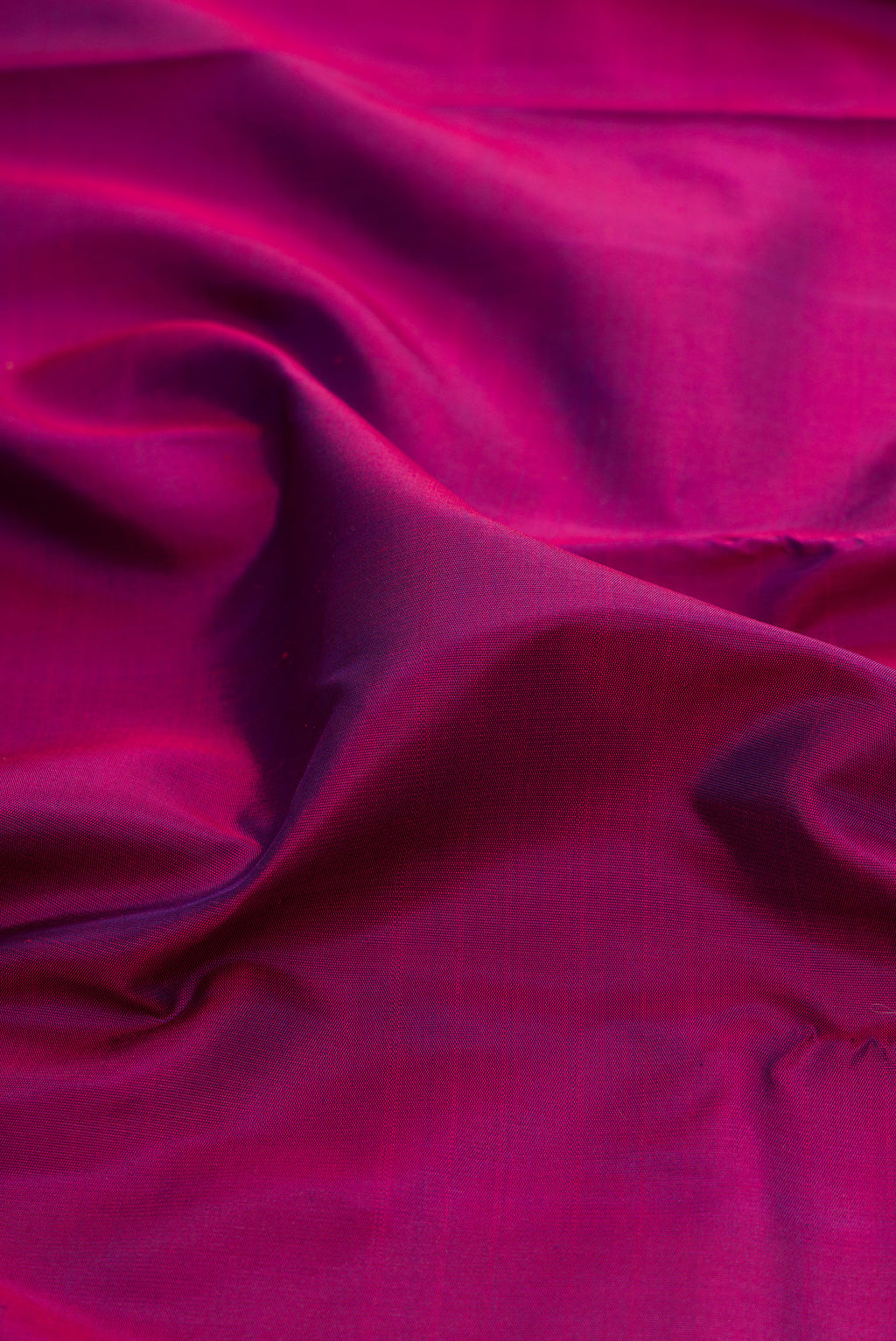 Close up of Pure Silk Pure Zari Purple Kanjivaram Saree with Plain Body and Temple Border.  displaying folds