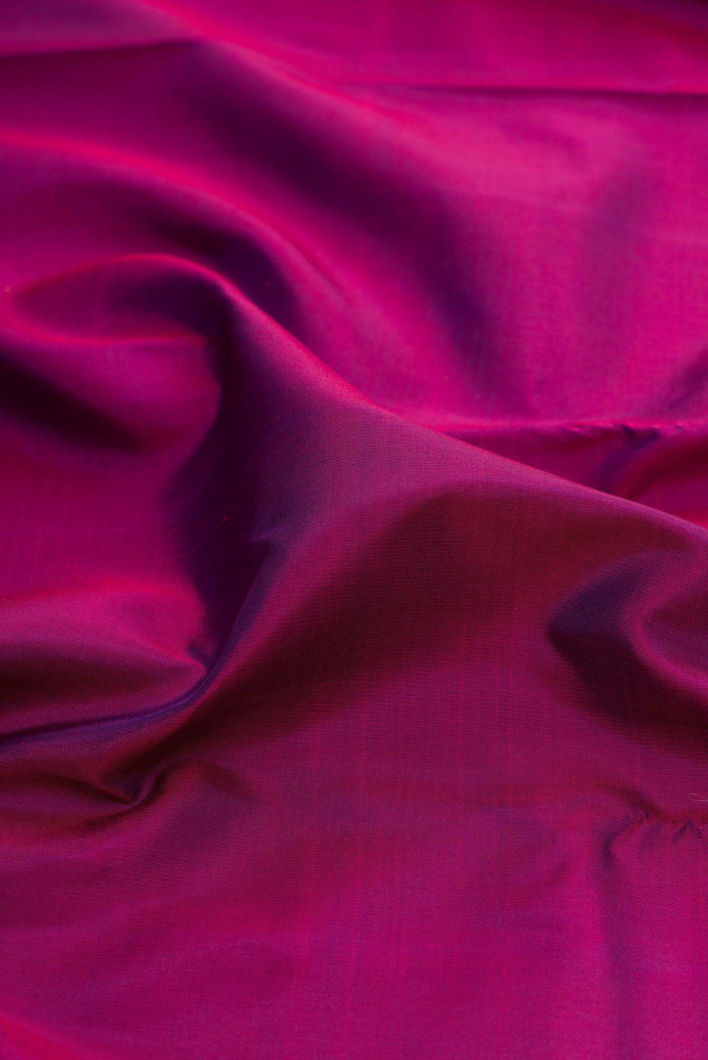 Close up of Pure Silk Pure Zari Purple Kanjivaram Saree with Plain Body and Temple Border.  displaying folds