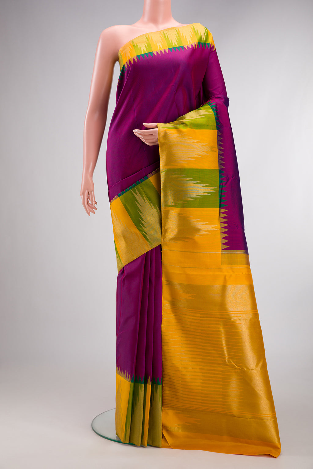 Pure Silk Pure Zari Purple Kanjivaram Saree with Plain Body and Temple Border.  displayed on a mannequin