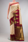 Pure Silk Pure Zari Beige Kanjivaram Saree with Plain Body and Temple Border.  displayed on a mannequin