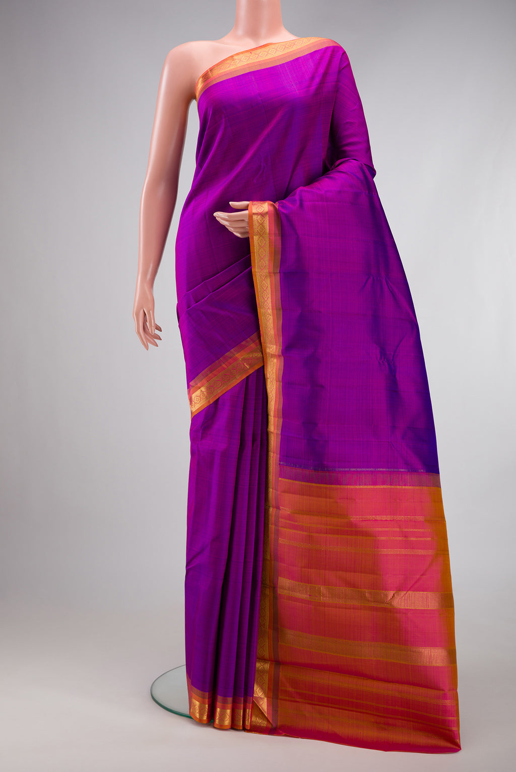 Purple Kanjivaram Silk Saree with Plain Body and Zari Border.  displayed on a mannequin