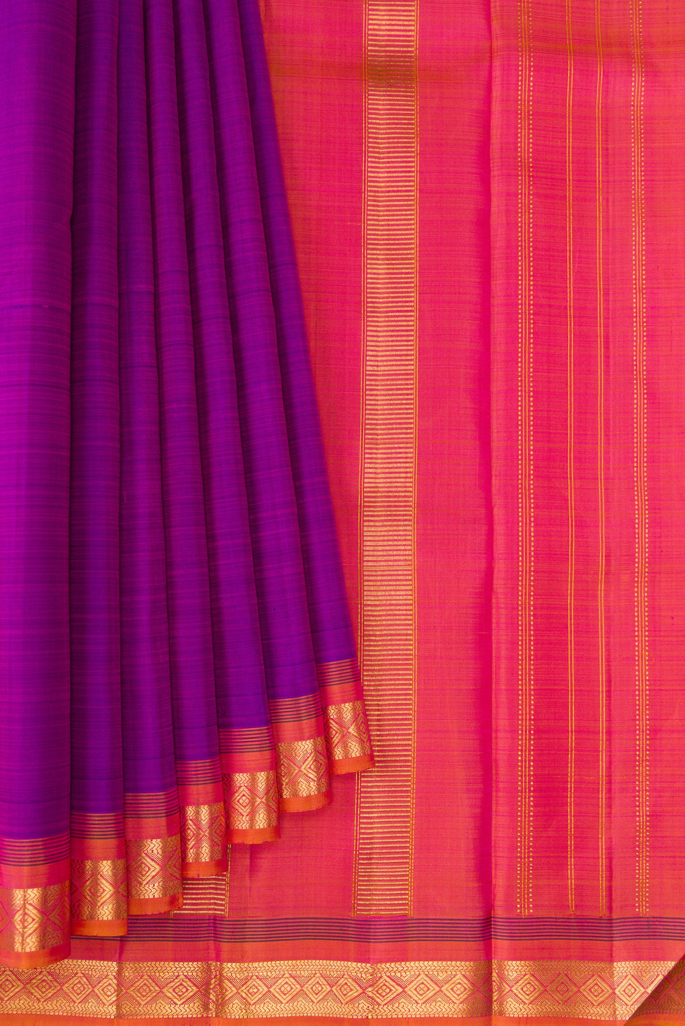 Pleats and pallu of Purple Kanjivaram Silk Saree with Plain Body and Zari Border. 