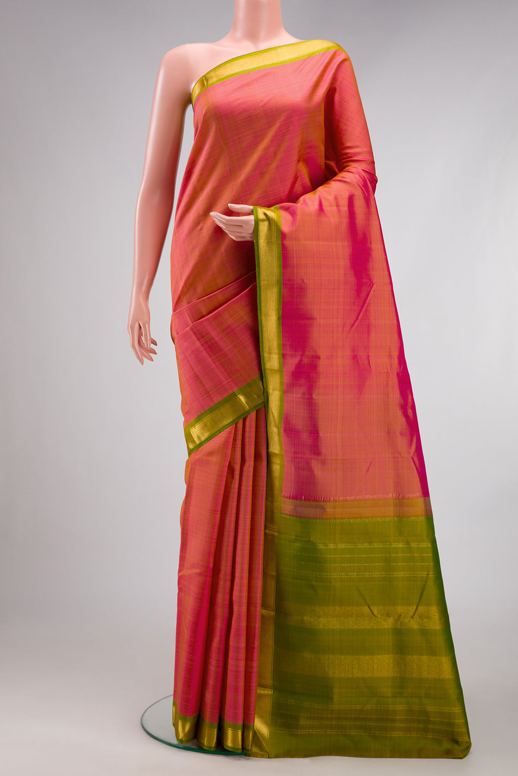 Pinkish Yellow Dual Tone Kanjivaram Silk Saree with Plain Body and Zari Border.  displayed on a mannequin