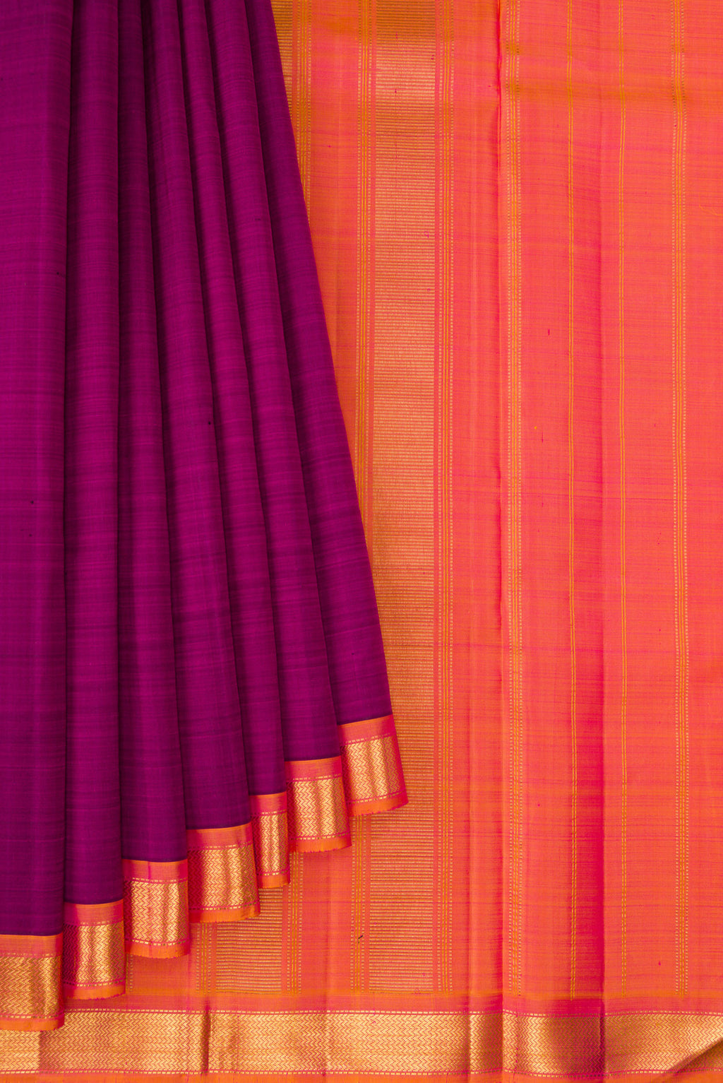 Pleats and pallu of Magenta Kanjivaram Silk Saree with Plain Body and Zari Border. 