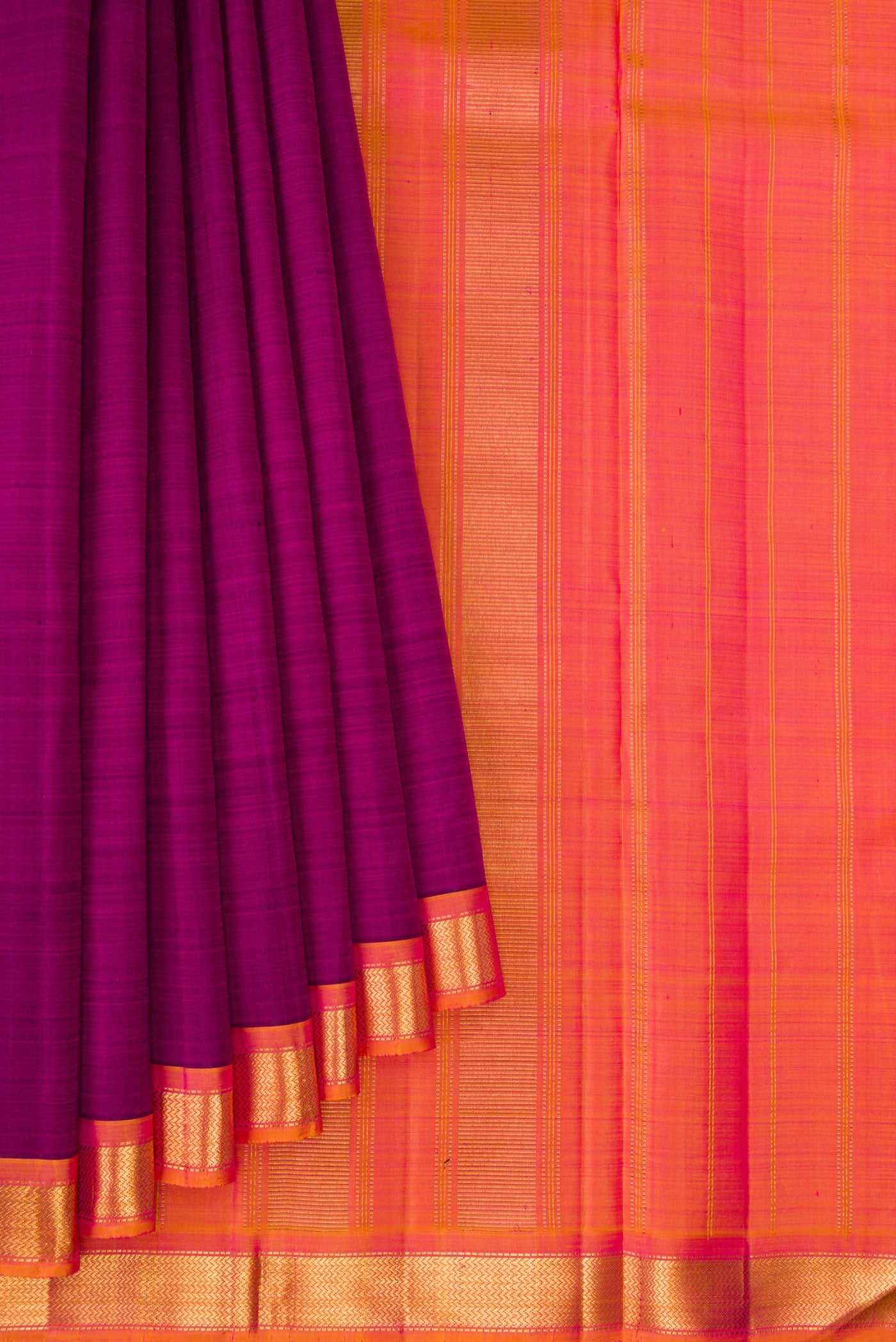 Pleats and pallu of Magenta Kanjivaram Silk Saree with Plain Body and Zari Border. 