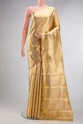 Pure Silk Pure Zari Gold Dual Tone Kanjivaram Tissue Saree with Zari Brocade on the body and Zari Border.  displayed on a mannequin