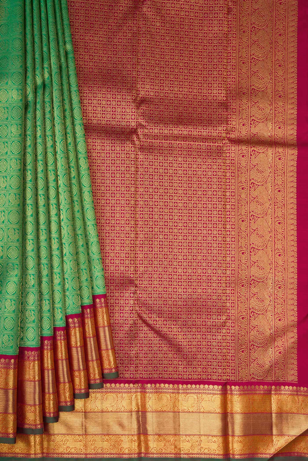 Pleats and pallu of Pure Silk Pure Zari Green Kanjivaram Saree with Zari Brocade on the body and Zari Border. 