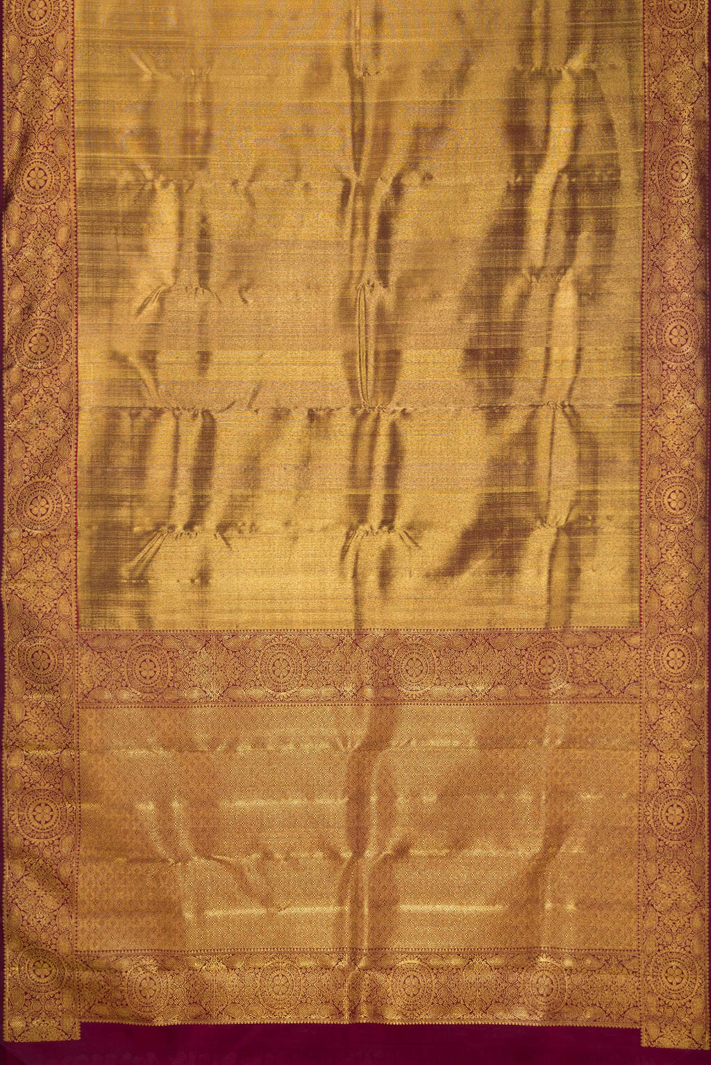 Flat view of Maroon Dual Tone Kanjivaram Silk Saree with Zari Brocade on the body and Zari Border. 