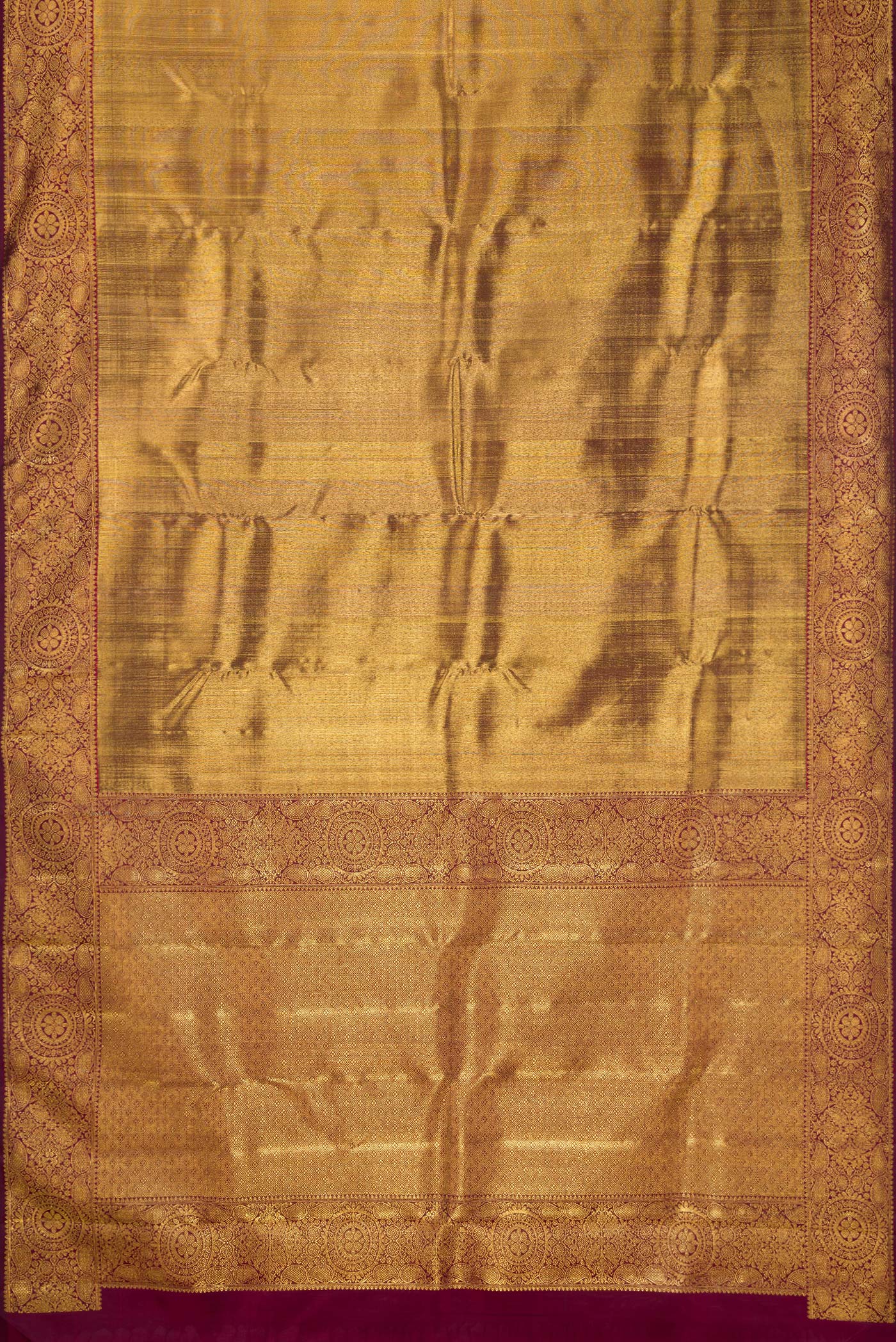 Flat view of Maroon Dual Tone Kanjivaram Silk Saree with Zari Brocade on the body and Zari Border. 