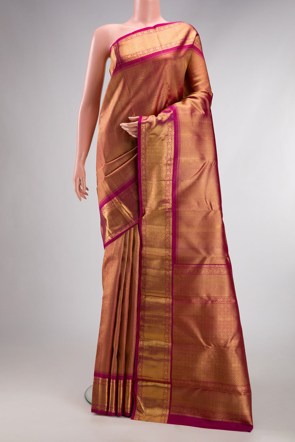 Pure Silk Pure Zari Magenta Dual Tone Kanjivaram Saree with Zari Brocade on the body and Zari Border.  displayed on a mannequin
