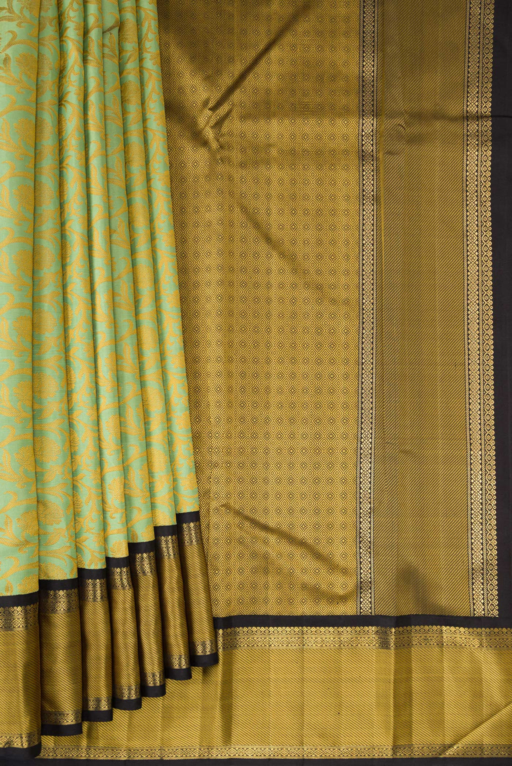 Pleats and pallu of Pure Silk Pure Zari Pista Green Kanjivaram Saree with Jacquard design on the body and Zari And Thread Border. 