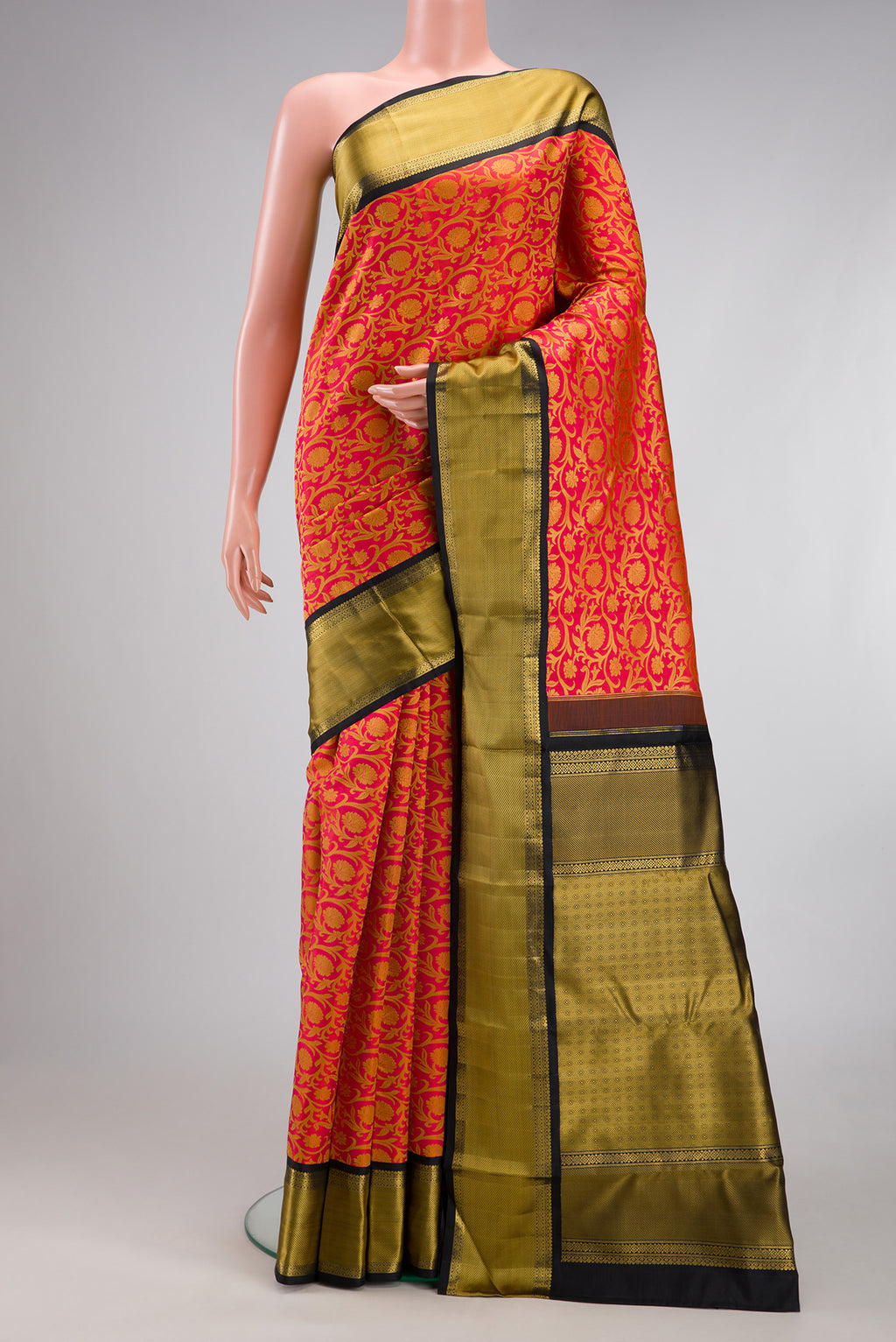 Pure Silk Pure Zari Orange Kanjivaram Saree with Jacquard design on the body and Zari And Thread Border.  displayed on a mannequin