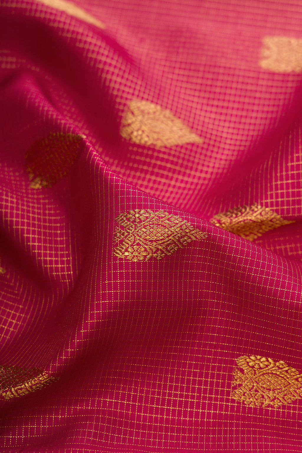 Close up of Pure Silk Pure Zari Maroon Kanjivaram Saree with Stripes on the body and Zari Border.  displaying folds