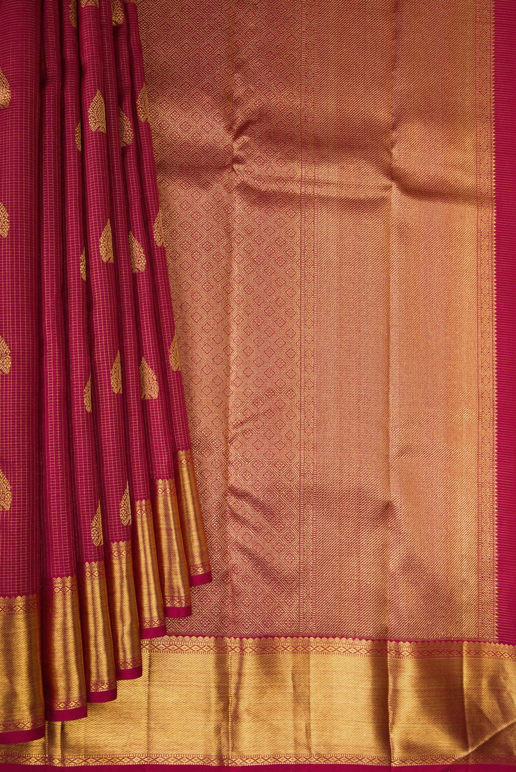 Pleats and pallu of Pure Silk Pure Zari Maroon Kanjivaram Saree with Stripes on the body and Zari Border. 
