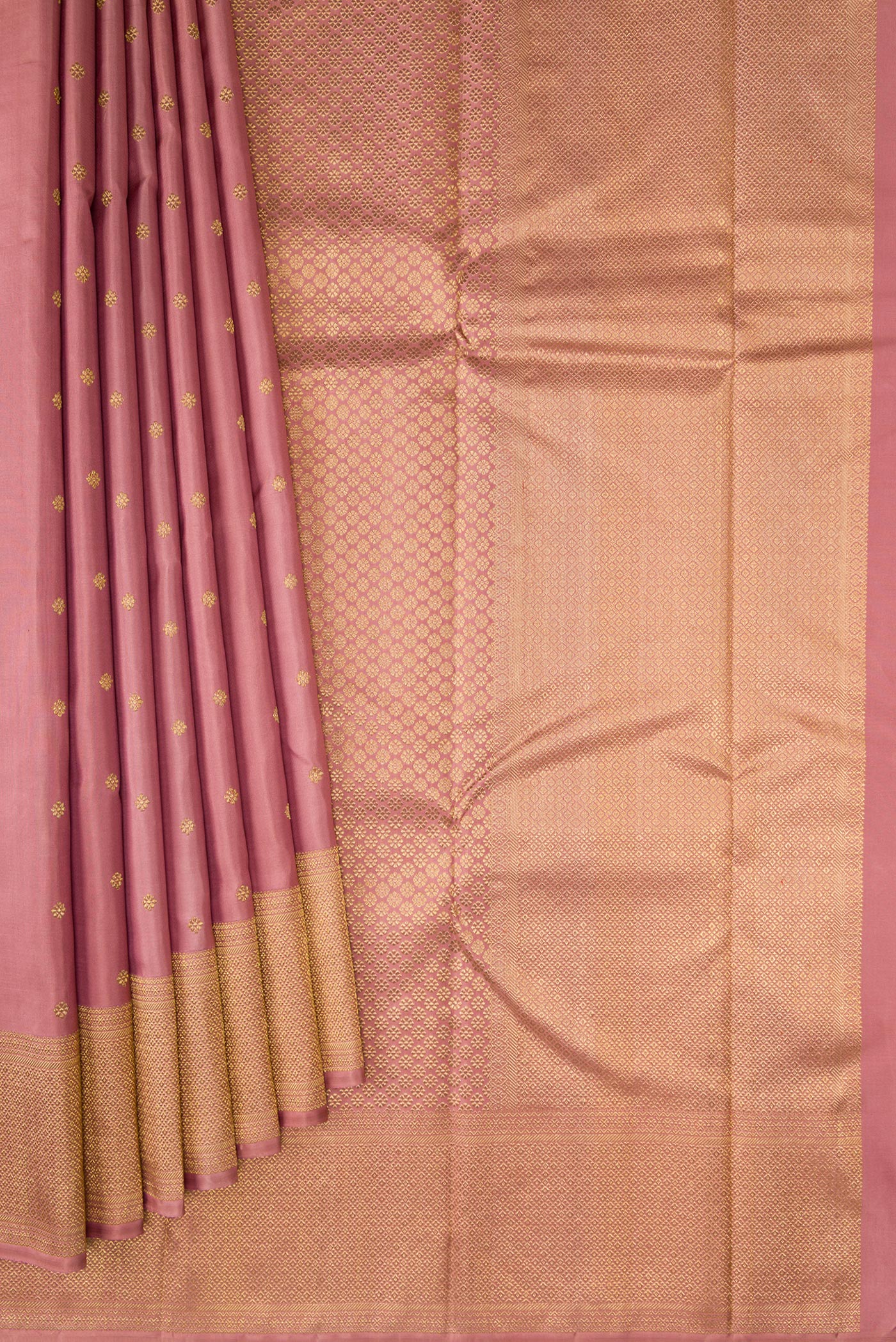 Pleats and pallu of Pure Silk Pure Zari Rose Gold Kanjivaram Saree with Zari Butta on the body and Zari Border. 