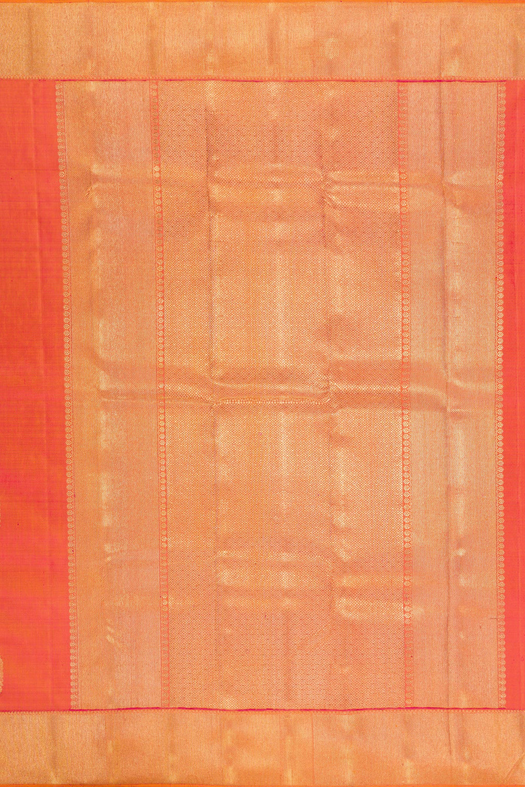 Close up image of the pallu of Pure Silk Pure Zari Brick Orange Dual Tone Kanjivaram Saree with Zari Butta on the body and Zari Border. 