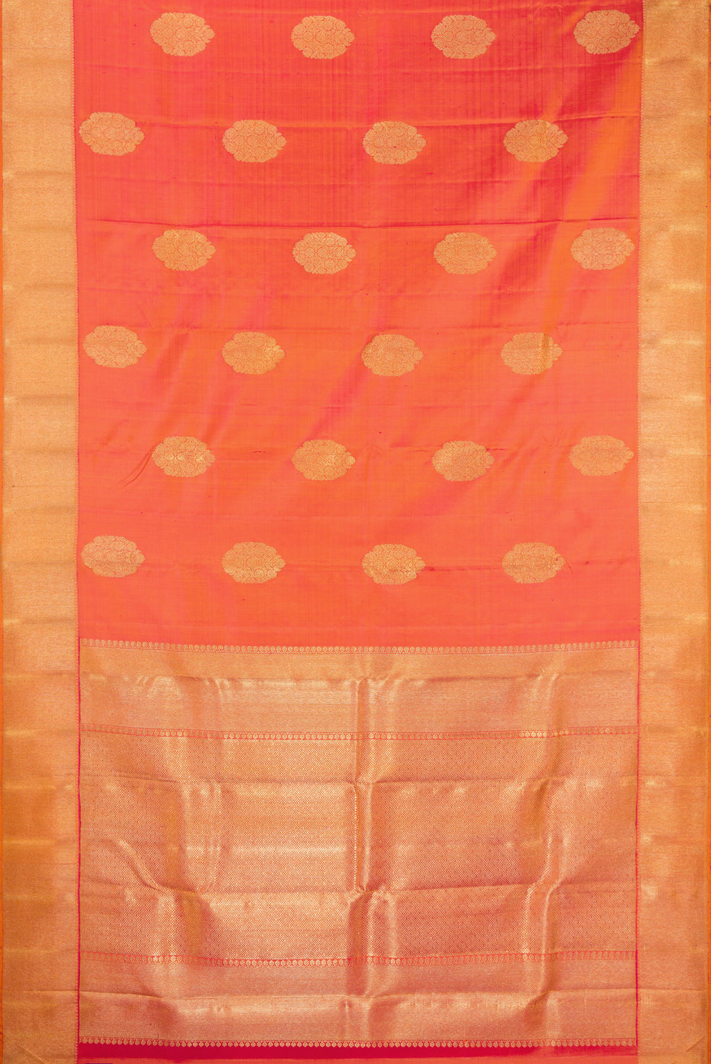 Flat view of Pure Silk Pure Zari Brick Orange Dual Tone Kanjivaram Saree with Zari Butta on the body and Zari Border. 