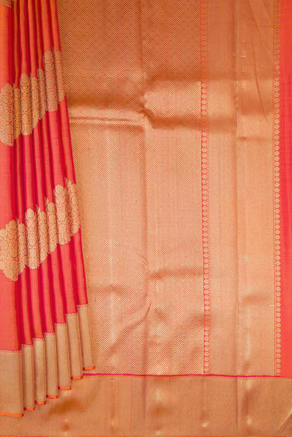 Pleats and pallu of Pure Silk Pure Zari Brick Orange Dual Tone Kanjivaram Saree with Zari Butta on the body and Zari Border. 