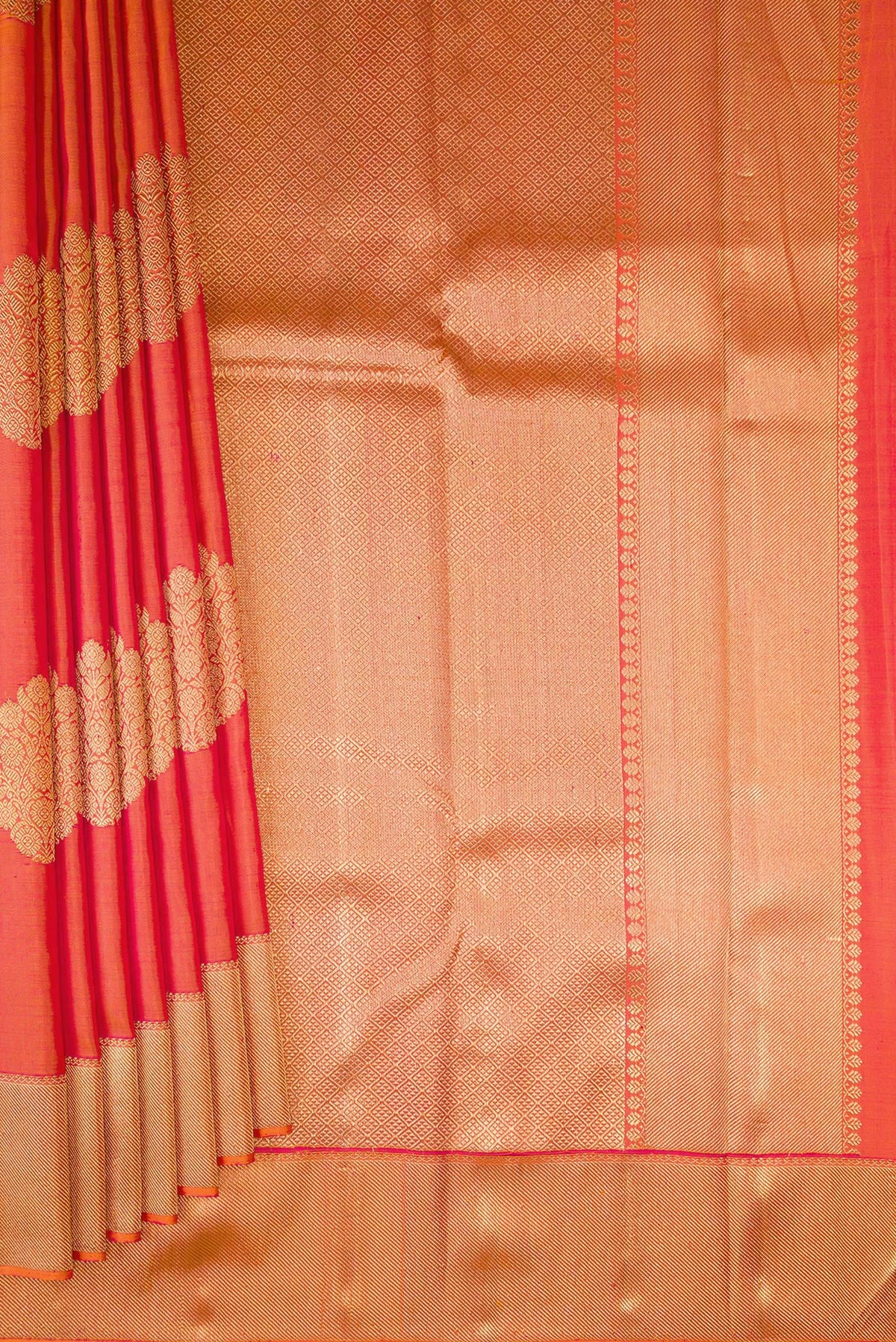 Pleats and pallu of Pure Silk Pure Zari Brick Orange Dual Tone Kanjivaram Saree with Zari Butta on the body and Zari Border. 