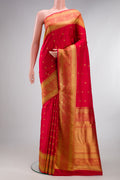 Pure Silk Pure Zari Red Kanjivaram Saree with Zari Butta on the body and Fancy Border.  displayed on a mannequin