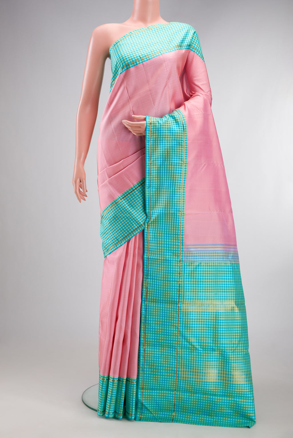 Rose pink Kanjivaram Silk Saree with Plain Body and Checks Border.  displayed on a mannequin