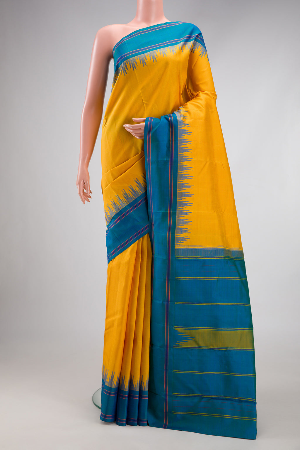 Yellow Kanjivaram Silk Saree with Checked design on the body and Temple Thread Border.  displayed on a mannequin