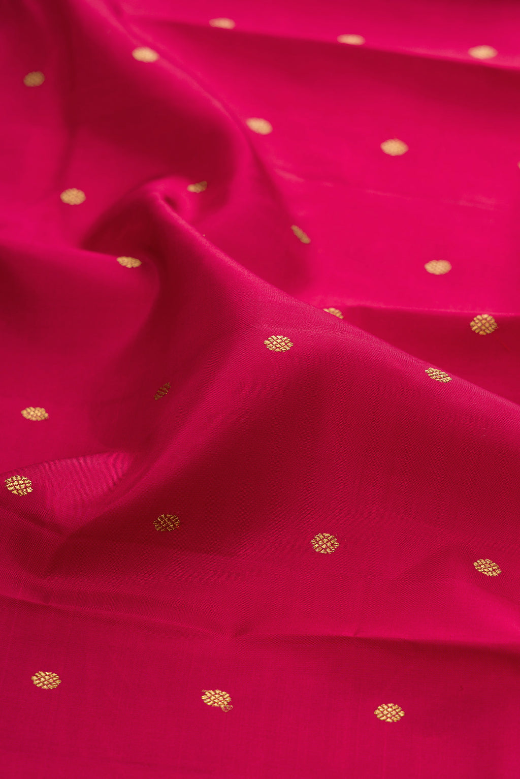 Close up of Pure Silk Pure Zari Maroon Kanjivaram Saree with Zari Butta on the body and Zari Border.  displaying folds