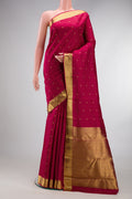 Pure Silk Pure Zari Maroon Kanjivaram Saree with Zari Butta on the body and Zari Border.  displayed on a mannequin