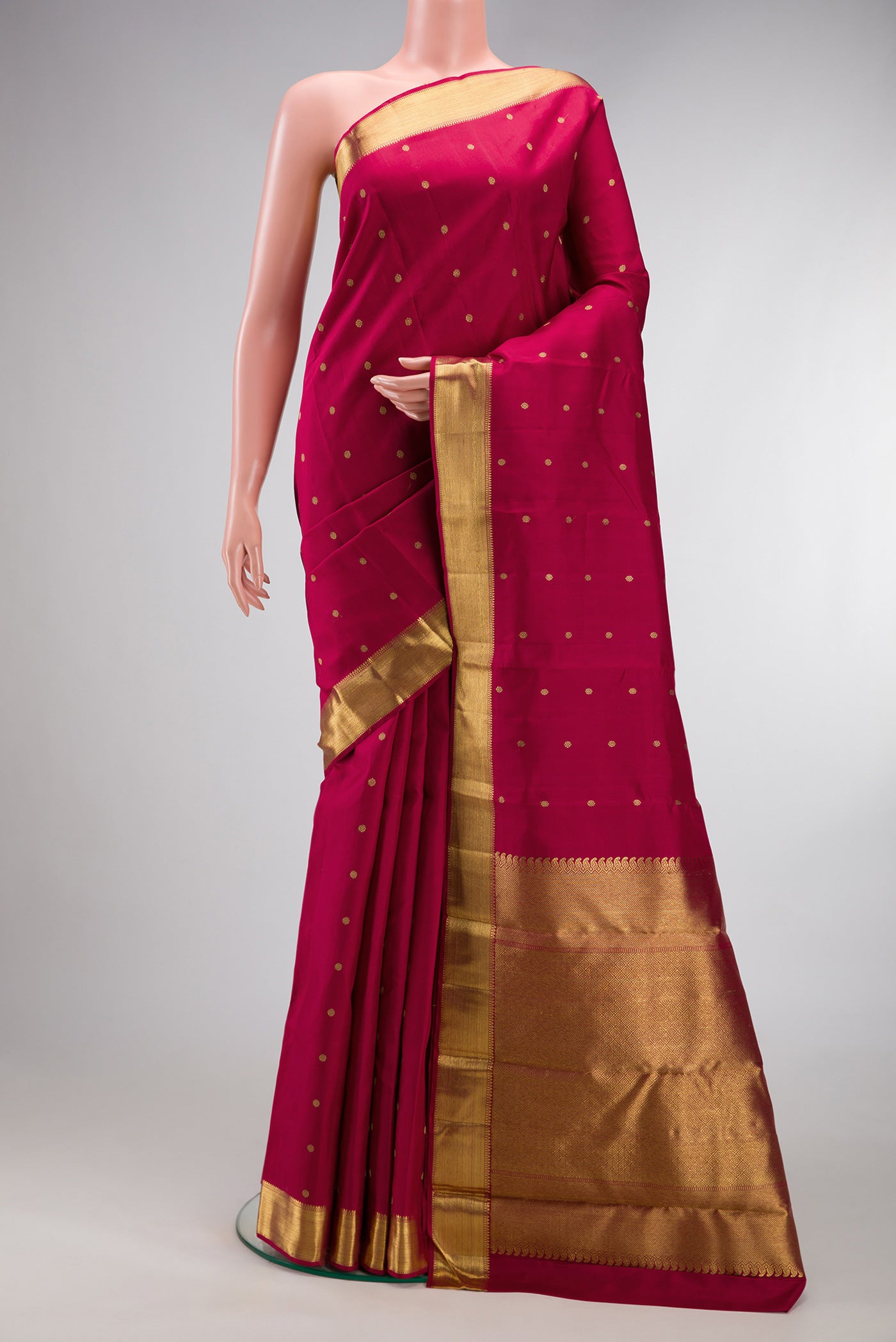 Pure Silk Pure Zari Maroon Kanjivaram Saree with Zari Butta on the body and Zari Border.  displayed on a mannequin