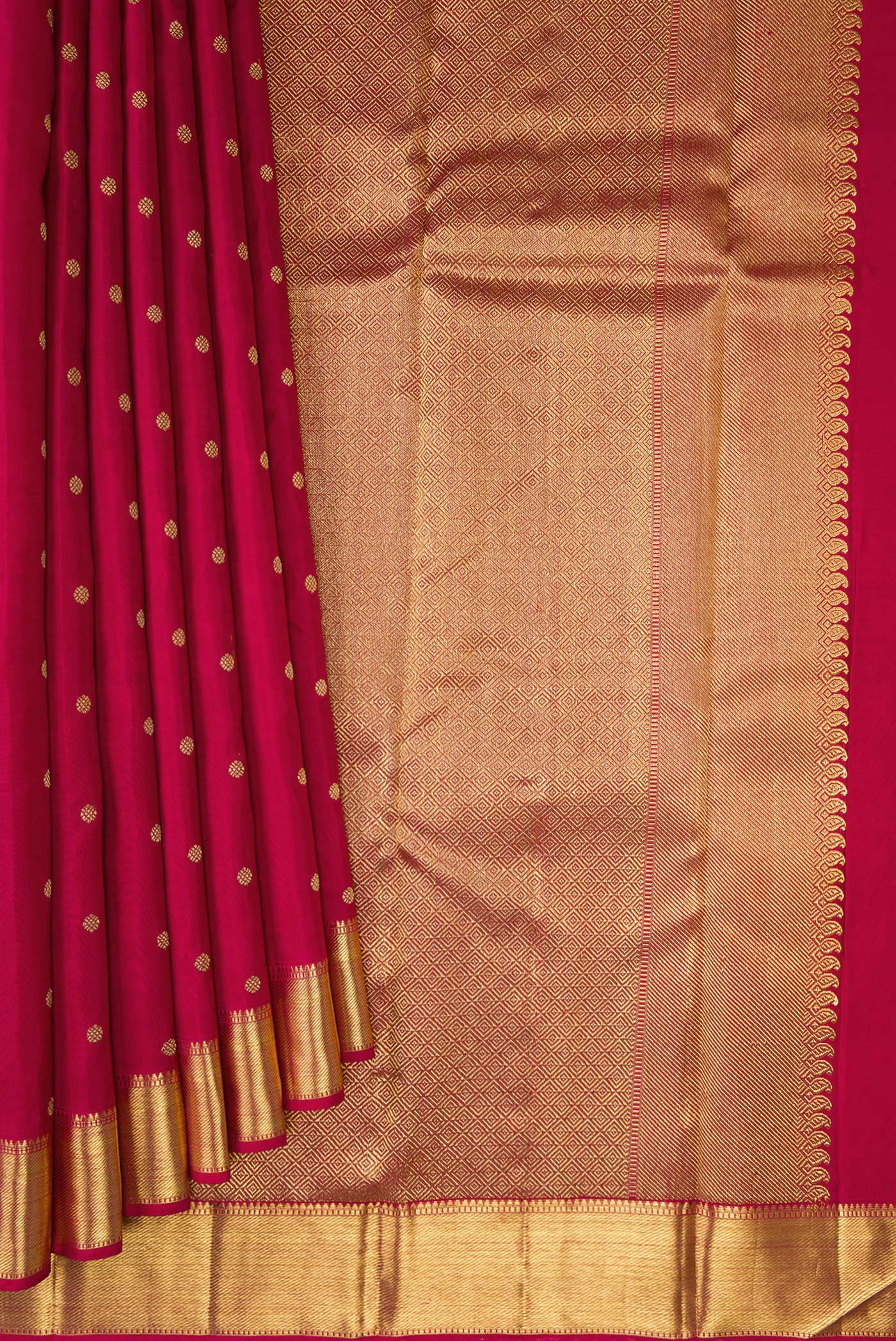 Pleats and pallu of Pure Silk Pure Zari Maroon Kanjivaram Saree with Zari Butta on the body and Zari Border. 