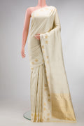 Pure Silk Pure Zari Cream Kanjivaram Saree with Jacquard design on the body and Fancy Border.  displayed on a mannequin