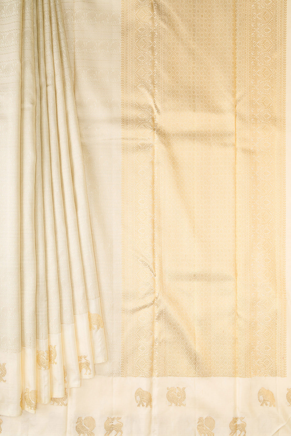 Pleats and pallu of Pure Silk Pure Zari Cream Kanjivaram Saree with Jacquard design on the body and Fancy Border. 