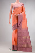 Peach Kanjivaram Silk Saree with Zari Butta on the body and Plain Border.  displayed on a mannequin