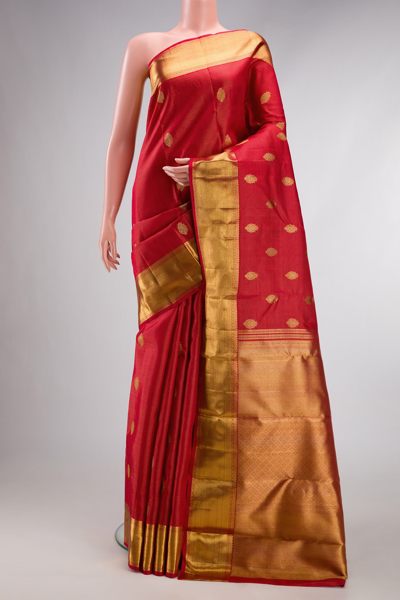 Pure Silk Pure Zari Deep Red Kanjivaram Saree with Stripes on the body and Zari Border.  displayed on a mannequin
