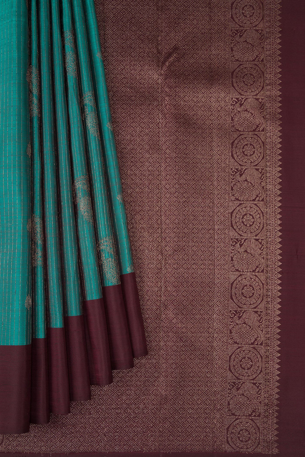 Pleats and pallu of Teal Kanjivaram Silk Saree with Stripes on the body and Plain Border. 