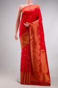 Red Kanchipuram Silk Saree with Zari Butta on the body and Fancy Border.  displayed on a mannequin