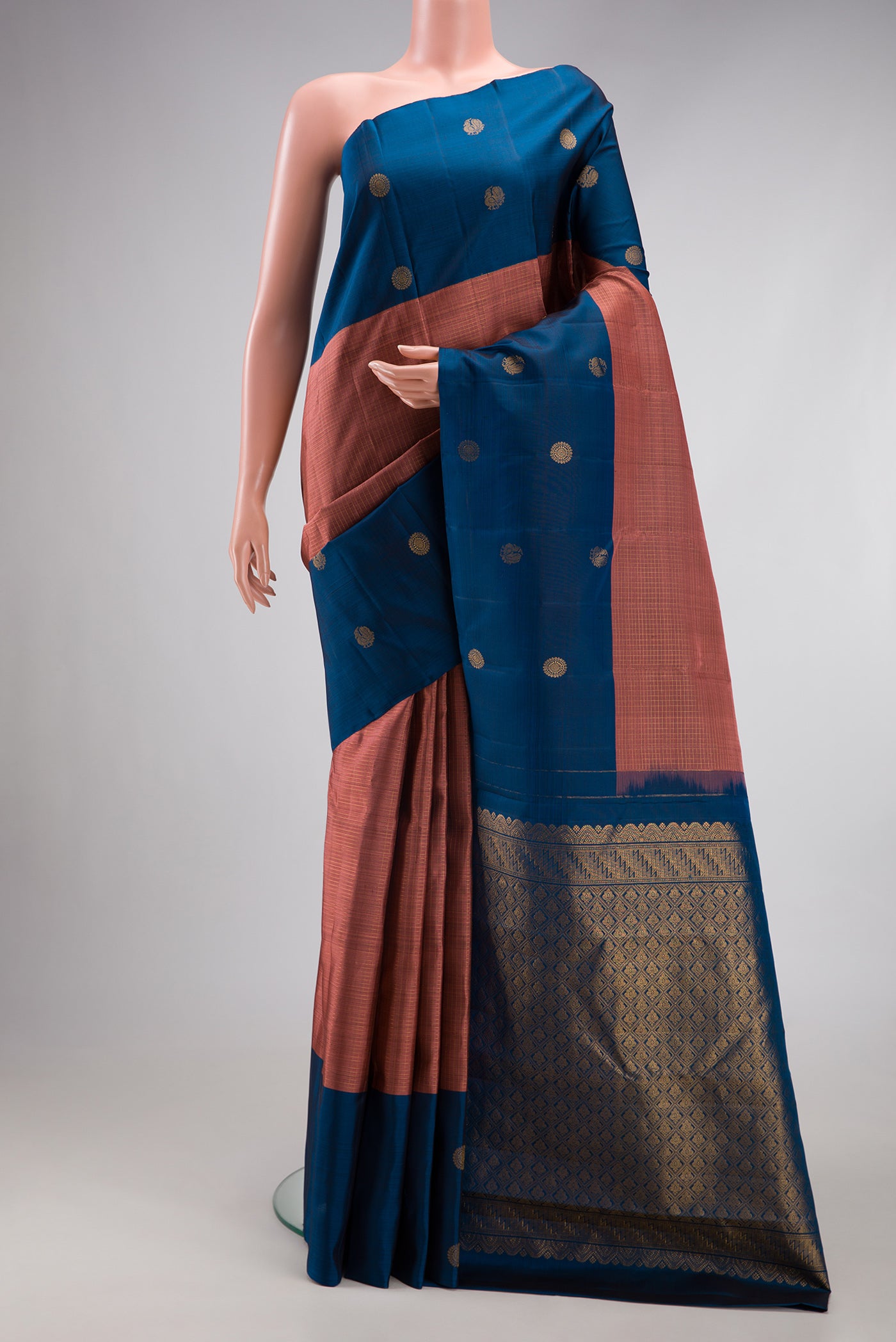 Rose Gold Kanjivaram Silk Saree with Checked design on the body and Fancy Border.  displayed on a mannequin