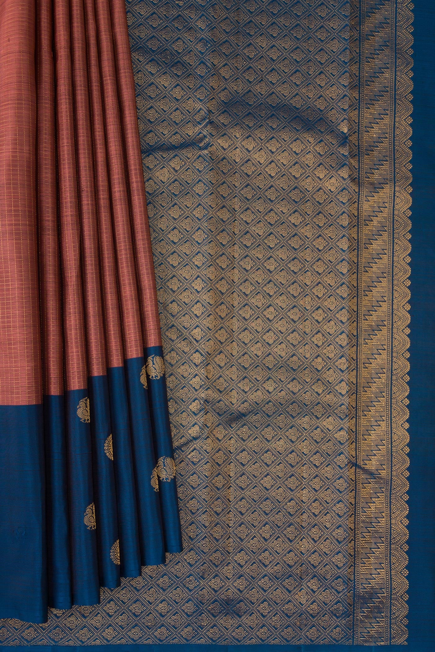 Pleats and pallu of Rose Gold Kanjivaram Silk Saree with Checked design on the body and Fancy Border. 