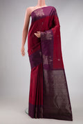 Maroon Kanchipuram Silk Saree with Zari Butta on the body and Fancy Border.  displayed on a mannequin