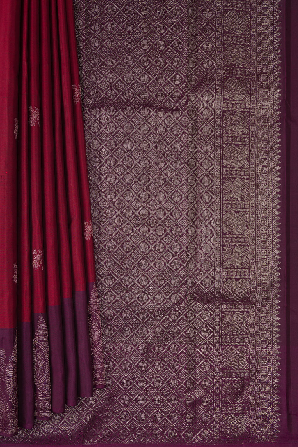 Pleats and pallu of Maroon Kanchipuram Silk Saree with Zari Butta on the body and Fancy Border. 