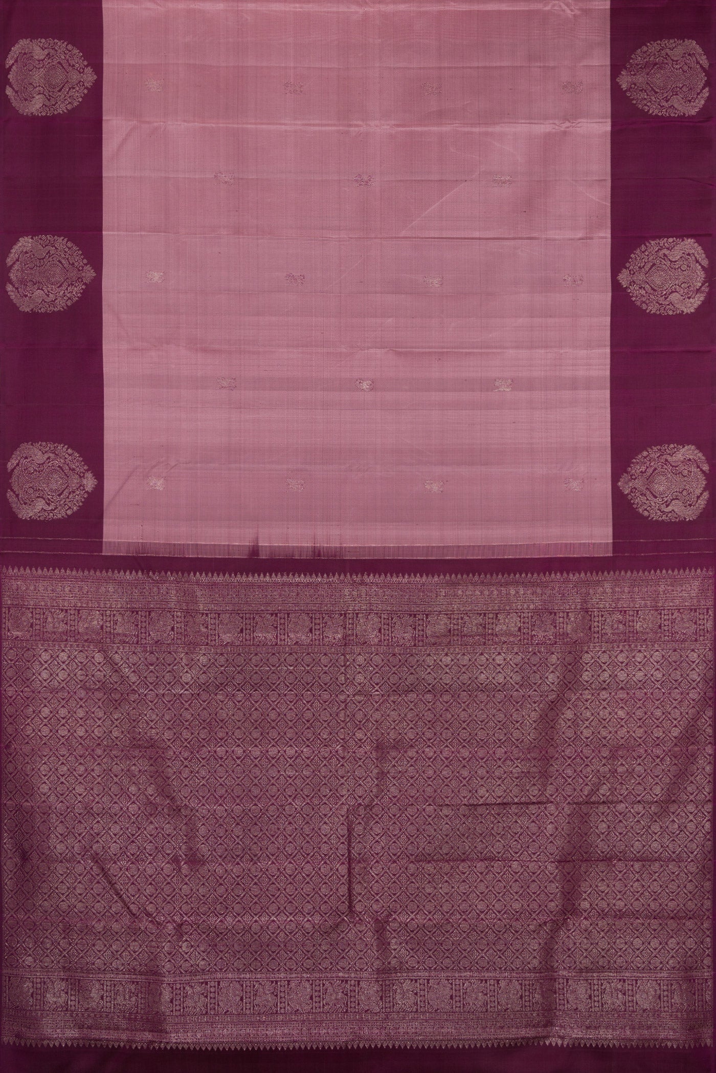Flat view of Mauve Kanchipuram Silk Saree with Zari Butta on the body and Fancy Border. 