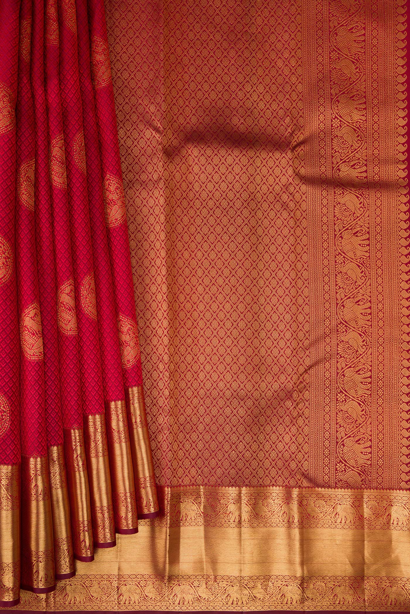 Pleats and pallu of Maroon Kanjivaram Silk Saree with Jacquard With Zari Butta on the body and Zari Border. 