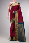 Pure Silk Red Kanjivaram Saree with Stripes on the body and Zari Border.  displayed on a mannequin